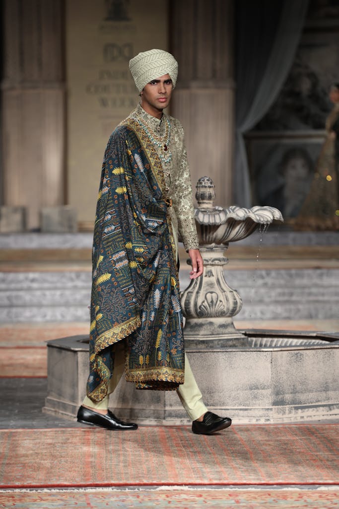 Editorial Photography of a Man in Sherwani Walking on Stage